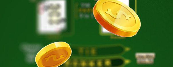 close-up of 2 coins flying above a blury online baccarat table